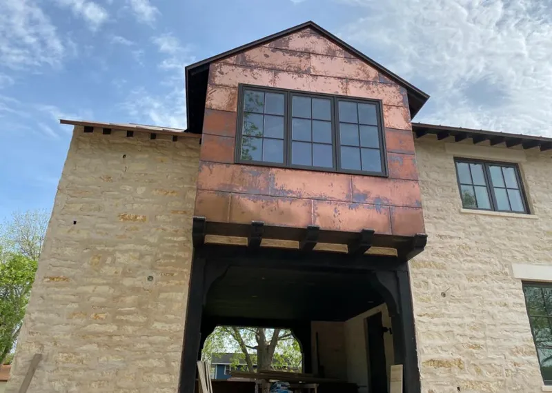 Copper metal panel facade on a stone building for Skylight Installation in Corte Madera